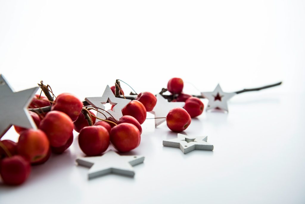 red cherries and white star decorations